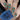 blue, red, pale green and mustard stylized floral nail art looks like retro wallpaper