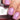 Close-up of hands with pink nail polish holding a bottle labeled 'Lake Tyrrell 12ml'.