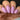 Close-up of a hand with pink nail polish on a blurred background