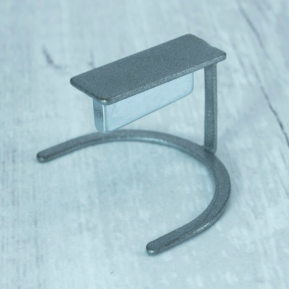 Magnet on stand with textured white background