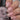 Hand holding a bottle of 'Hit the Bottle' nail polish with a neutral nail color.