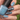 blue stamping over brown polish leaf design nail art