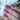 purple stamping over coral polish holding cup