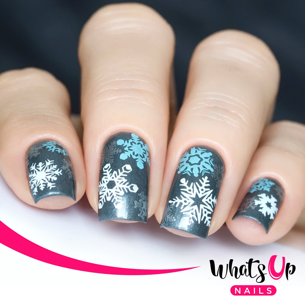dark green base white and blue snowflakes nail art stamping