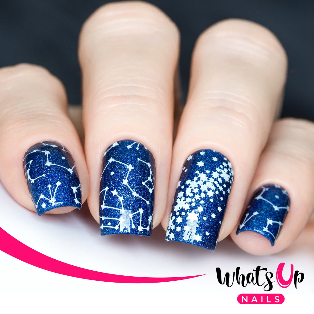 constellation nail art, white stars on blue background