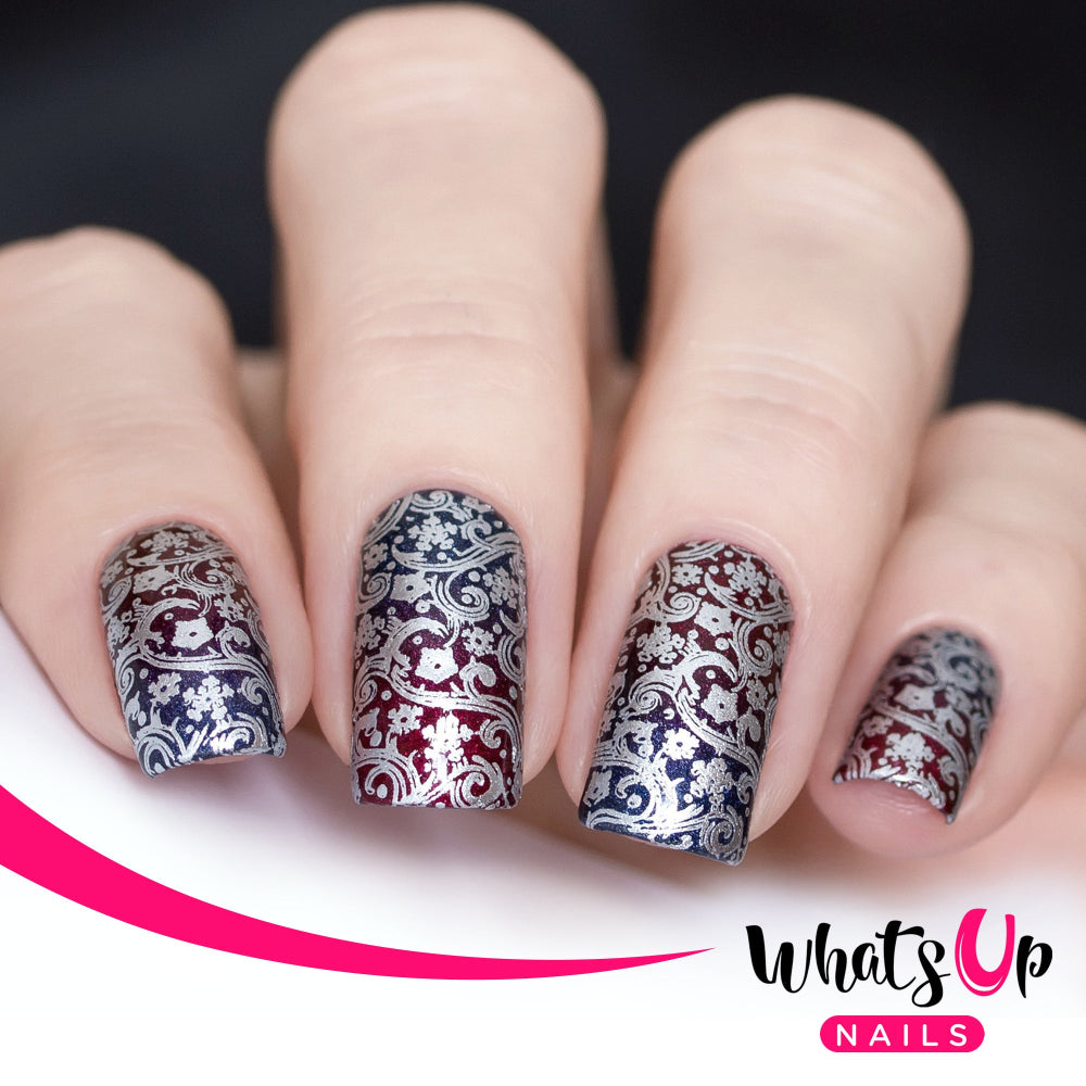 red and blue nails with ornate silver design