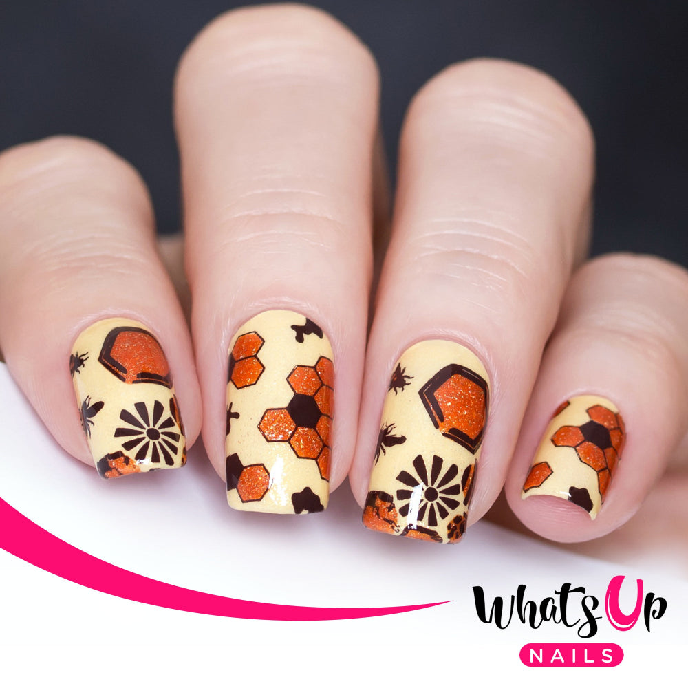 pale yellow nails with brown and orange bee nail art design