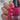 Hand with pink nail polish holding a bottle of pink nail polish labeled 'Hit the Bottle'.