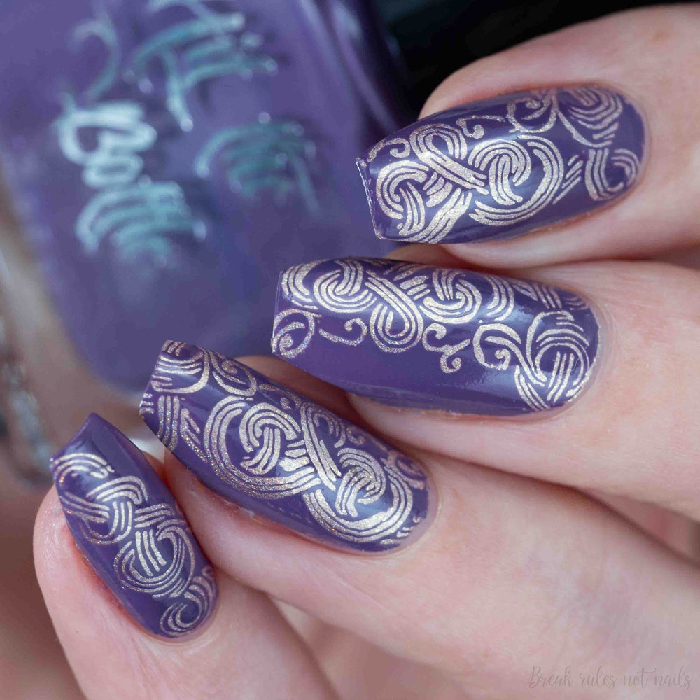 purple stamping celtic design over gold 