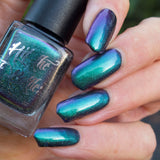 "Parrot Fashion" a multichrome nail polish by Hit the Bottle. Shifts from emerald green, to blue to purple.