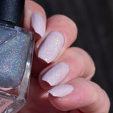 holo-topcoat-over-pale-pink-in-sun-angle