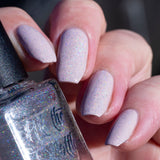 holo-topcoat-over-pale-pink-in-sun-angle
