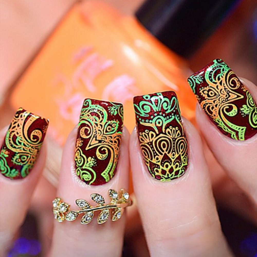 neon green and orange ornate nail art 