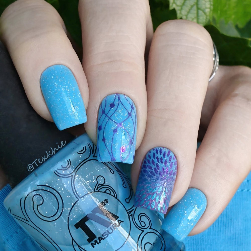 violet stamping over blue nails