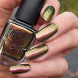 "Bronzewing Fling" a multichrome nail polish from Hit the Bottle. Shifts from a rosy copper, to gold to a brilliant green. 