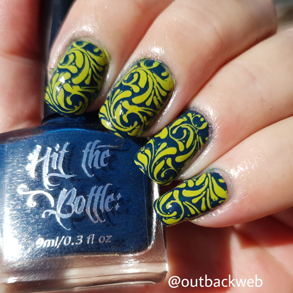 green stamping over blue nails 